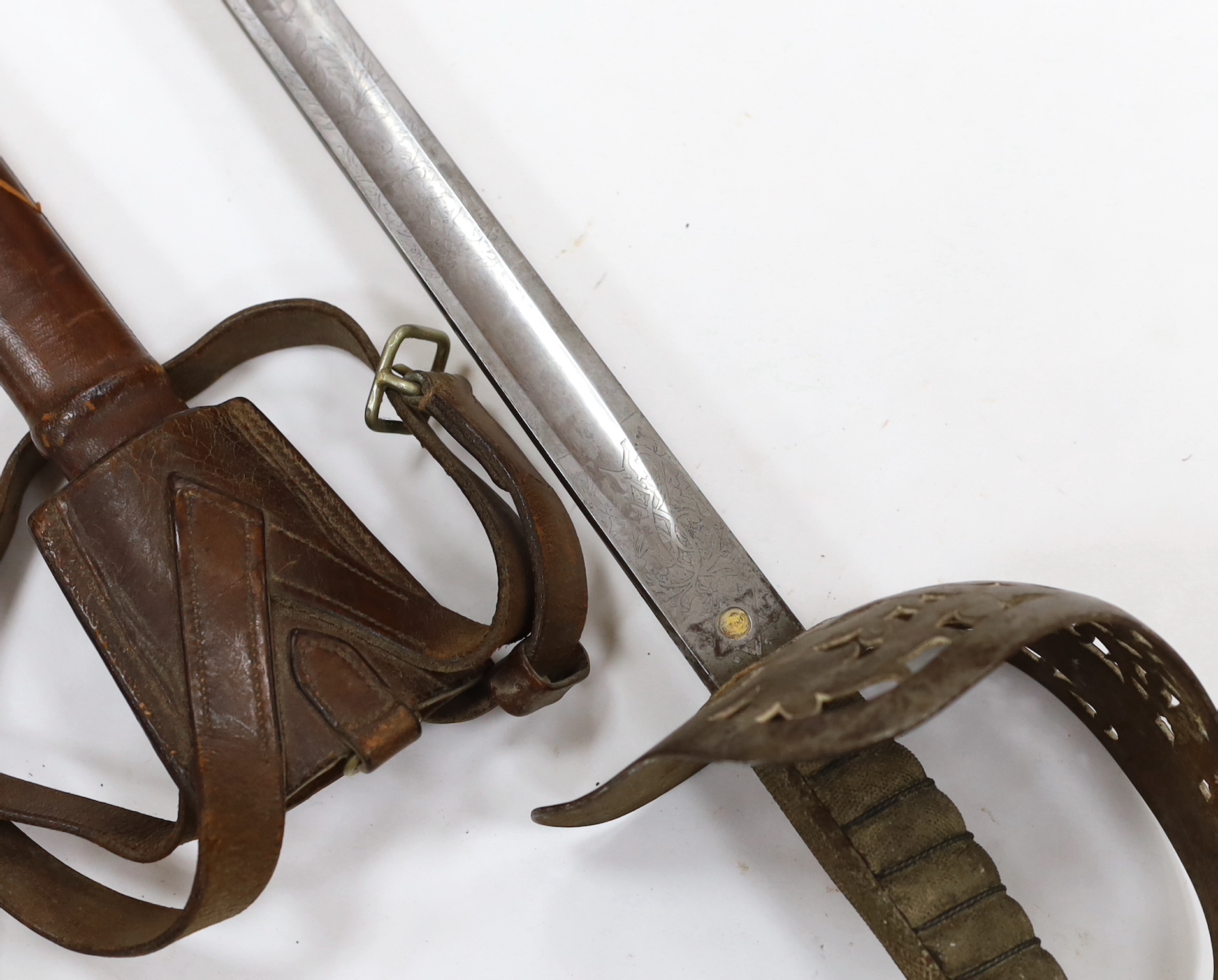 A Victorian 1897 pattern infantry officer's sword, maker Robert Mole & Sons, Birmingham, marked War and India offices, with scabbard and leather hanger, blade 82cm